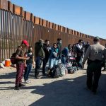 Border Czar Shares HORRIFIC ICE Prison Scene Border patrol agents interact with a group of people.