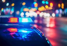 Man With Countless Arrests STABS Pregnant Woman! Police car with flashing lights at night.