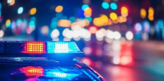 Man With Countless Arrests STABS Pregnant Woman! Police car with flashing lights at night.