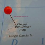 A map showing the Chagos Archipelago with a red pin marking the location