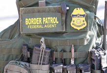 Drugged Kids At Border — DOJ Drops Bomb Border Patrol vest with gear and communication equipment.
