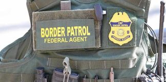 Drugged Kids At Border — DOJ Drops Bomb Border Patrol vest with gear and communication equipment.