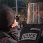 Police ATTACKED After World Cup Chaos protester faces police officer in riot gear