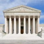 SCOTUS Decision Hands China The Advantage Front view of the Supreme Court building with large columns and steps under a blue sky