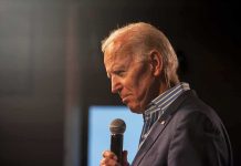 Court Issues DAMNING Biden Verdict – Karma! elderly man holding a microphone on stage