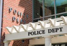 Islamization Now BIGGER Threat Than Gangs Police department entrance with pergola and brick wall