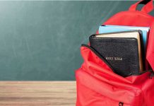 SCOTUS Takes Up 10 Commandment Case Red backpack with books on a classroom desk
