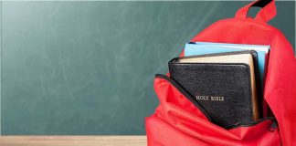 SCOTUS Takes Up 10 Commandment Case Red backpack with books on a classroom desk
