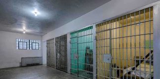 ICE Jail Death Sparks National Outrage Interior view of a prison cell block with metal bars and concrete flooring