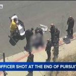 Maniac Charges at Cops With Tree Trimmer Officer hit in bulletproof vest, suspect shot by LAPD after chase ends in Boyle Heights