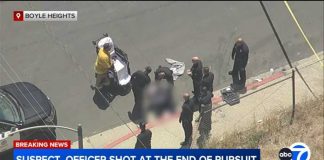 Maniac Charges at Cops With Tree Trimmer Officer hit in bulletproof vest, suspect shot by LAPD after chase ends in Boyle Heights