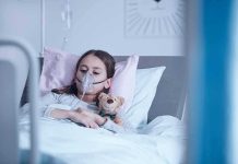 Child Euthanasia Goes Ahead – Toddler DEAD Child in hospital bed with oxygen mask holding teddy bear