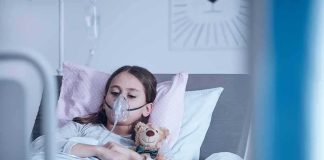 Child Euthanasia Goes Ahead – Toddler DEAD Child in hospital bed with oxygen mask holding teddy bear