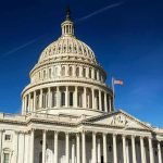 Tariff Brawl Erupts In Congress United States Capitol dome against clear blue sky