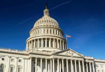 Tariff Brawl Erupts In Congress United States Capitol dome against clear blue sky