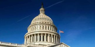 Tariff Brawl Erupts In Congress United States Capitol dome against clear blue sky