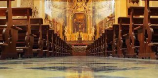 Dem Rep Slams Churches ‘Too Many Republicans There’ Church interior with wooden pews facing ornate altar