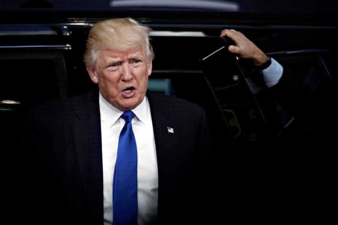 Donald Trump stepping out of a vehicle in a suit and blue tie