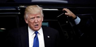 Trump Picks Singer’s Wife For TOP Ambassador Job man in suit stepping out of a vehicle