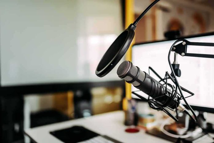 Podcast microphone with pop filter on desk
