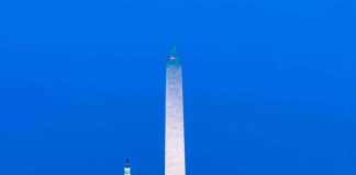 Washington Monument with Lincoln Memorial and Capitol at dusk