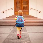Disabled Toddler Sentenced to DEATH – Bizarre Ruling child with backpack walking toward school steps