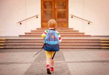 Disabled Toddler Sentenced to DEATH – Bizarre Ruling child with backpack walking toward school steps