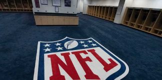 NFL logo on the floor of an empty locker room
