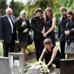 Grieving Parents Smeared As ‘White Supremacists’ Mourners gathered at a graveside placing flowers