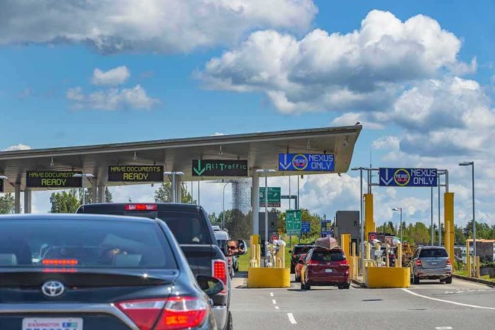 shutterstock_1364379374 Vehicles queue at a border crossing checkpoint