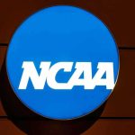 NCAA Star SUSPENDED For Disgusting On Field Action NCAA logo on a blue circular sign