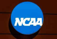 NCAA Star SUSPENDED For Disgusting On Field Action NCAA logo on a blue circular sign