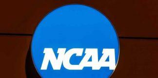 NCAA Star SUSPENDED For Disgusting On Field Action NCAA logo on a blue circular sign