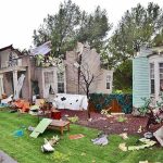Car Explodes Before Dawn – Rocks Neighborhood! Houses with significant storm damage and debris scattered around the yard