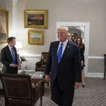 Trump Secures $1 Trillion Deal! Donald Trump walks through an office with Sean Lawler nearby and Mariano Rajoy following behind
