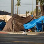 12 DEAD – Coordinated Attack STRIKES City! Street tents covered with tarps along a sidewalk