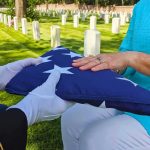 What Happened to Widow of Airman Killed in Iran Is Infuriating Folded American flag presented at a cemetery