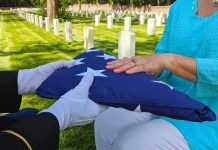 What Happened to Widow of Airman Killed in Iran Is Infuriating Folded American flag presented at a cemetery