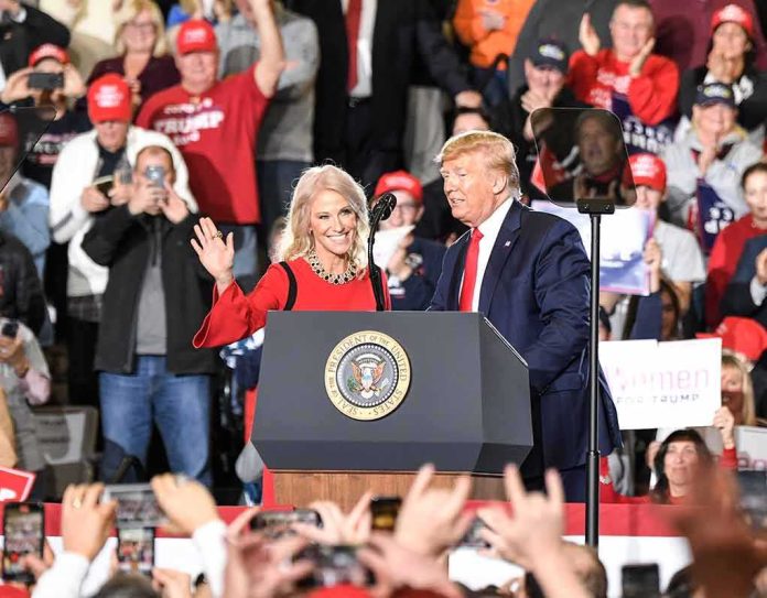 shutterstock_1629769585 Donald Trump and Russ Huesman on stage at a rally podium