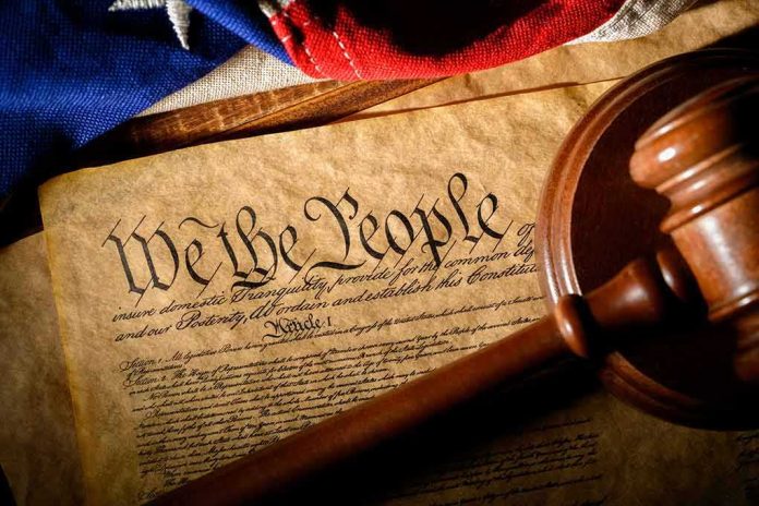U.S. Constitution with gavel and flag