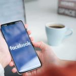 Man Who Mocked Kirk’s Assassination Wins MASSIVE $850K Settlement Person holding smartphone with Facebook app open