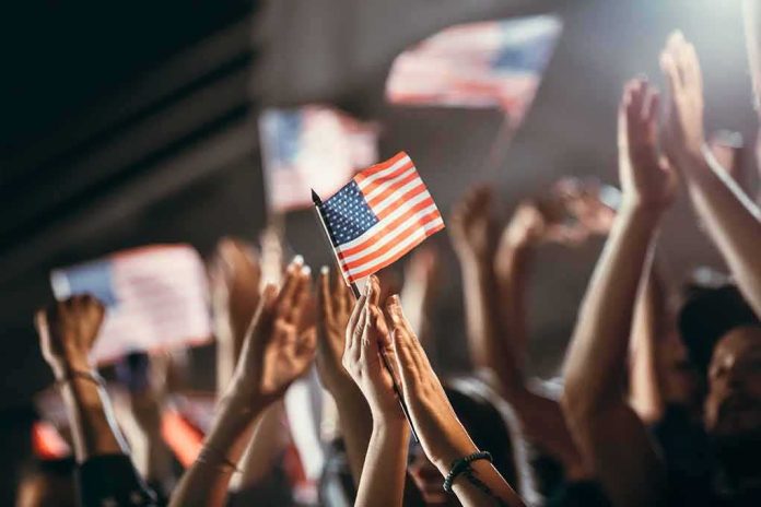 American flag waved by crowd