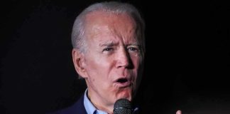 Joe Biden speaking into a microphone