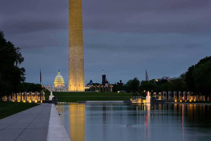 shutterstock_1832405857 Washington Monument and reflecting pool at dusk