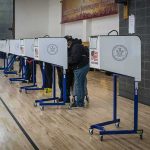 Woke State Allows 400,000 Voters Register Without ID Voters at polling booths in a gymnasium