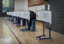 Woke State Allows 400,000 Voters Register Without ID Voters at polling booths in a gymnasium