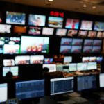 FAA Meltdown Freezes ALL Flights! control room with multiple screens and monitors