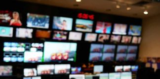control room with multiple screens and monitors