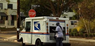 USPS Mailman ARRESTED – Feds Make Disturbing Discovery Mail carrier standing behind a USPS truck on a suburban street