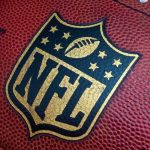 NFL Star Wades Into DCF Custody Inferno Close-up of an NFL football with the logo prominently displayed